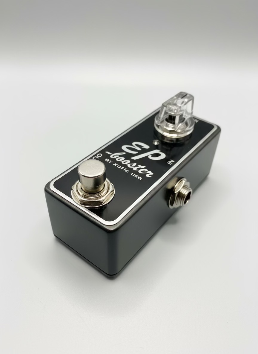 Guitar effects pedal labeled 'EP Booster by Xotic USA' on a wooden surface