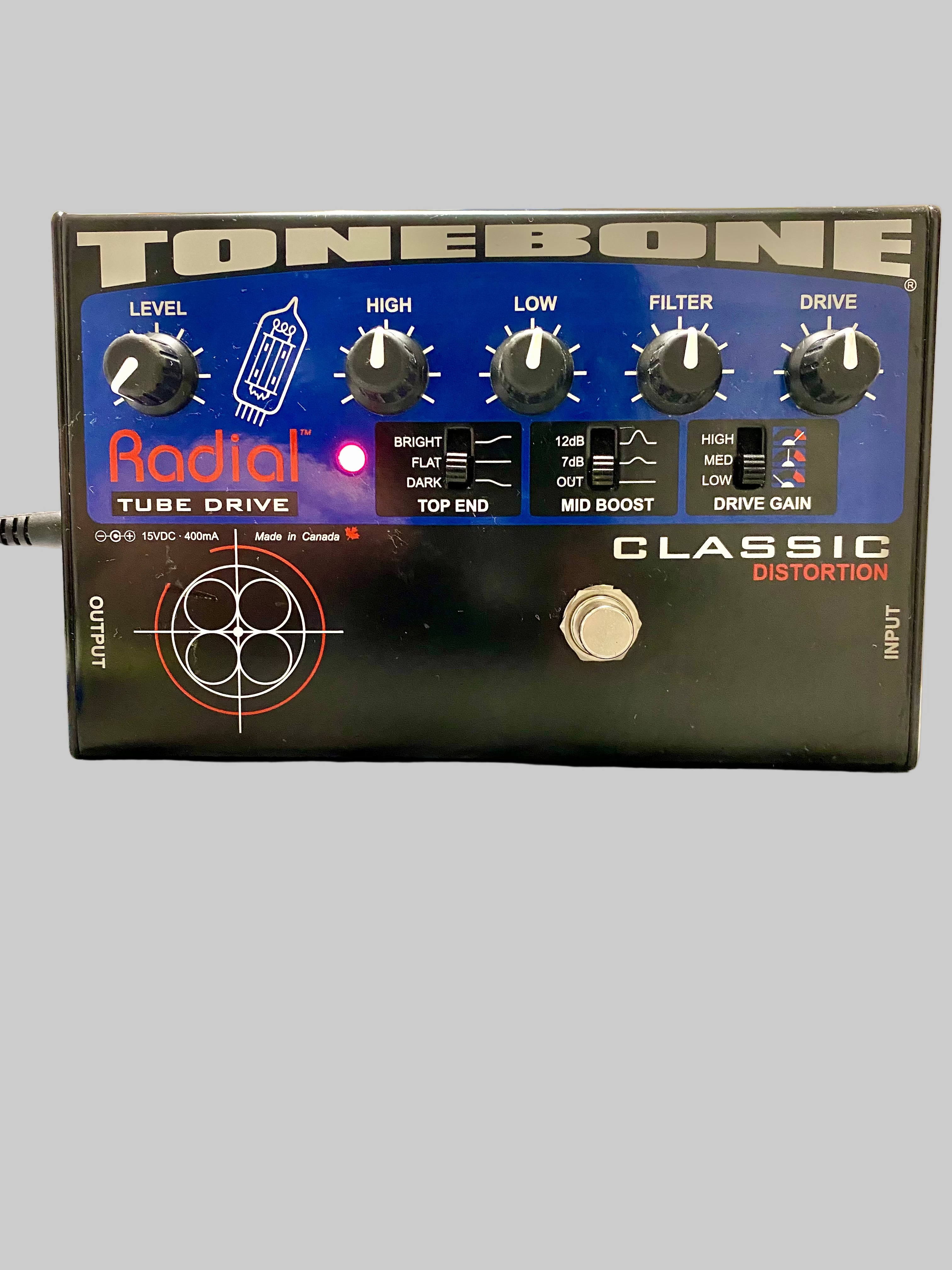 Radial Tonebone Tube Drive guitar effects pedal on a reflective surface