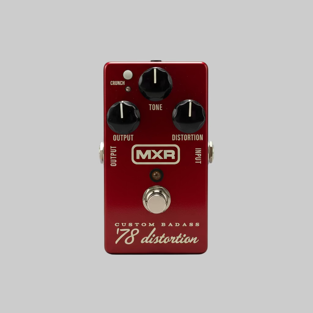 Red MXR guitar effects pedal on a table with a blurred background