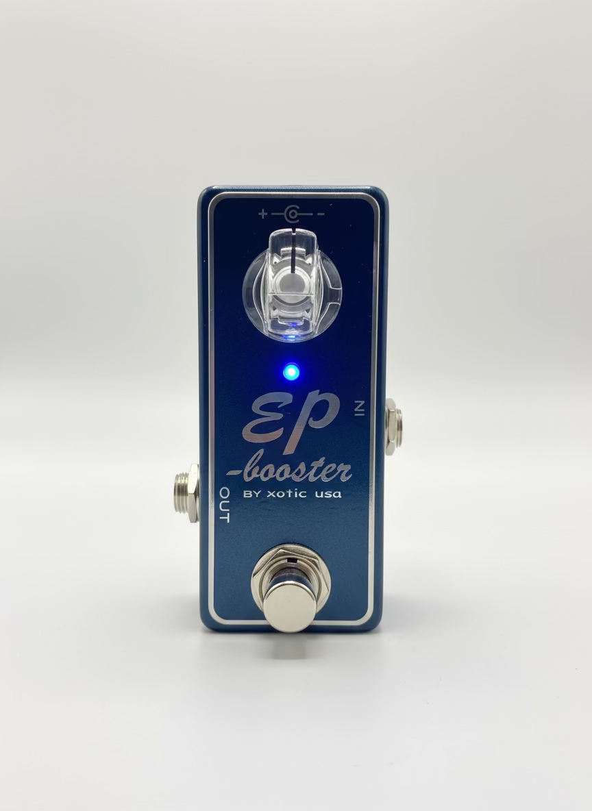 Guitar effects pedal labeled 'EP Booster' by Xotic USA on a wooden surface.