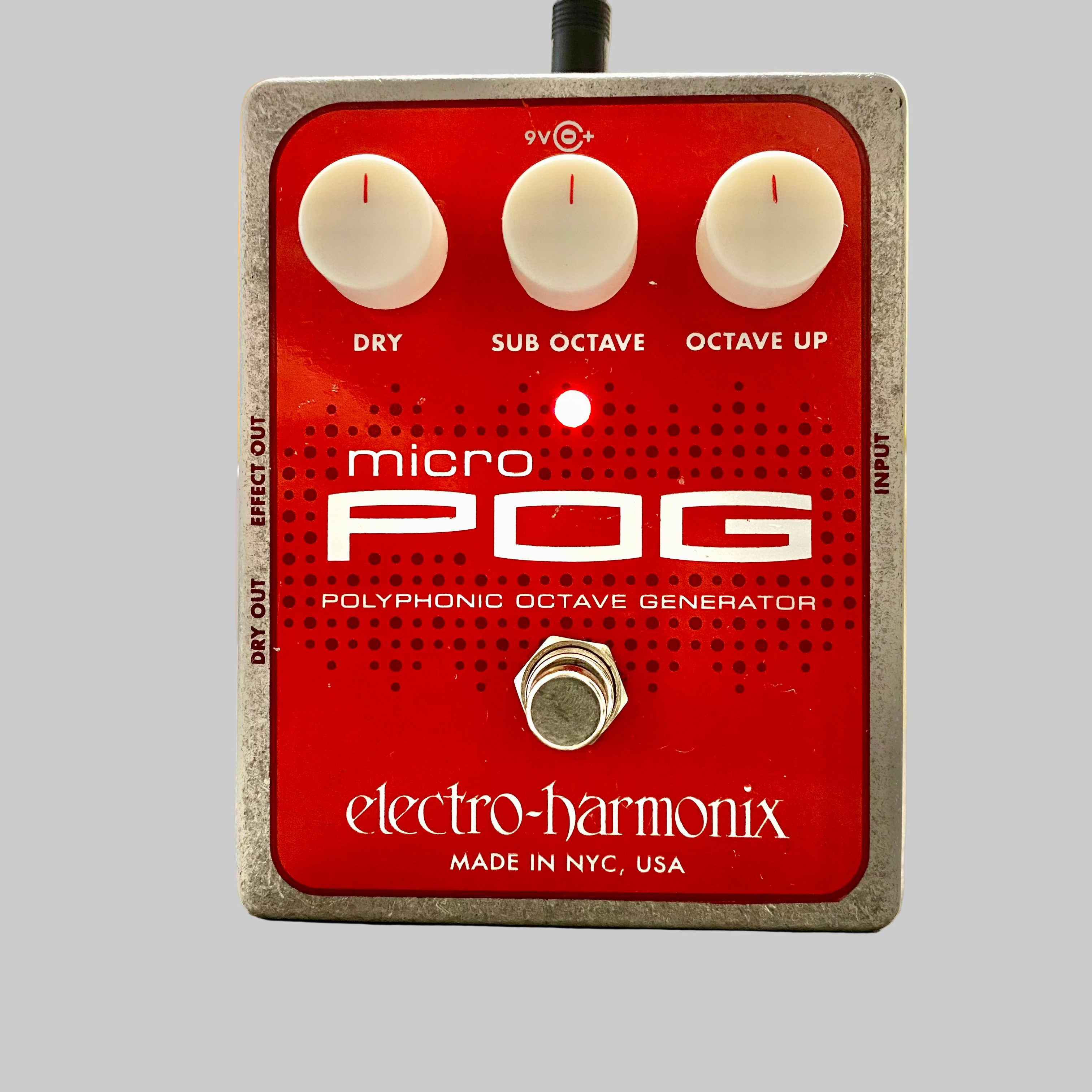 Electro-Harmonix micro POG polyphonic octave generator on a wooden surface