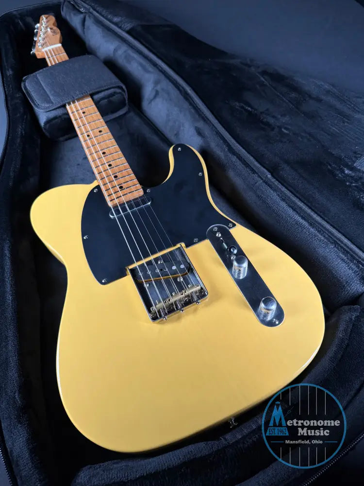 Butterscotch electric guitar in a black case