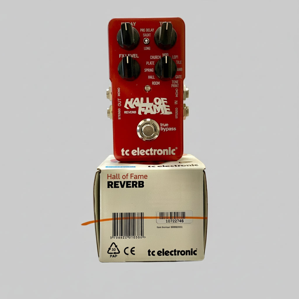 Red guitar effects pedal with 'Hall of Fame' and 'tc electronic' branding on a white box.