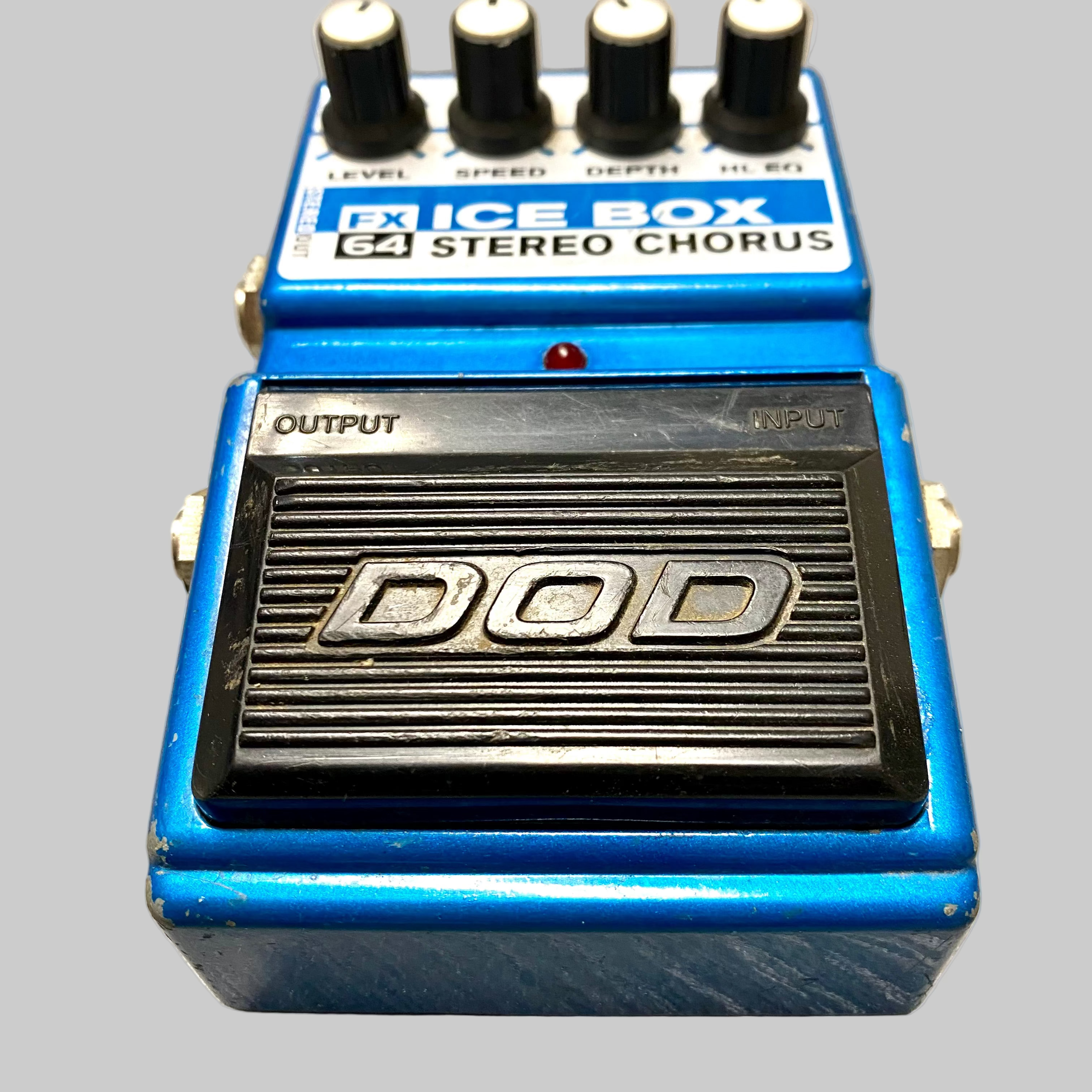 Blue DOD FX-64 Stereo Chorus pedal on a gray surface