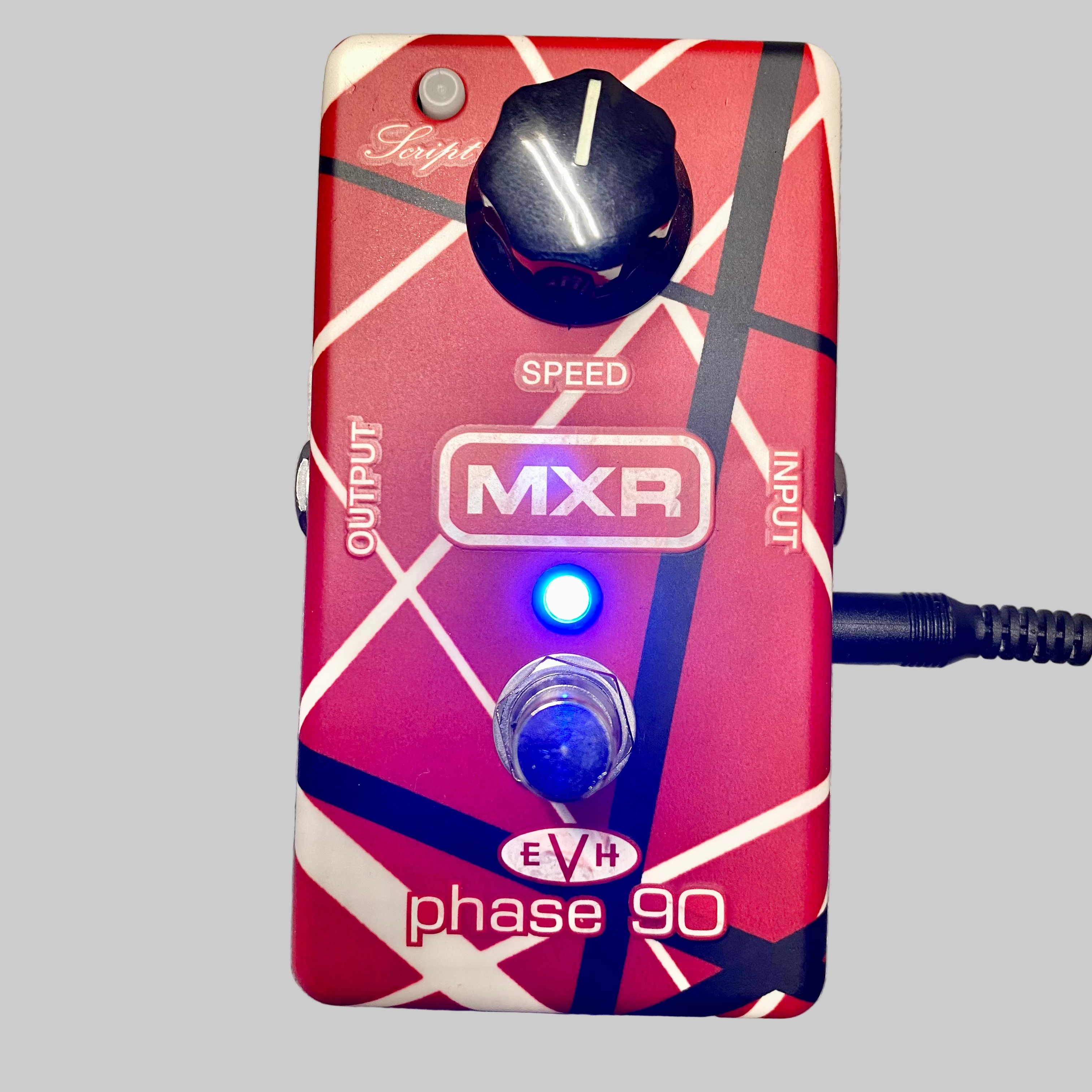 Guitar effects pedal with MXR and EVH branding on a gray surface