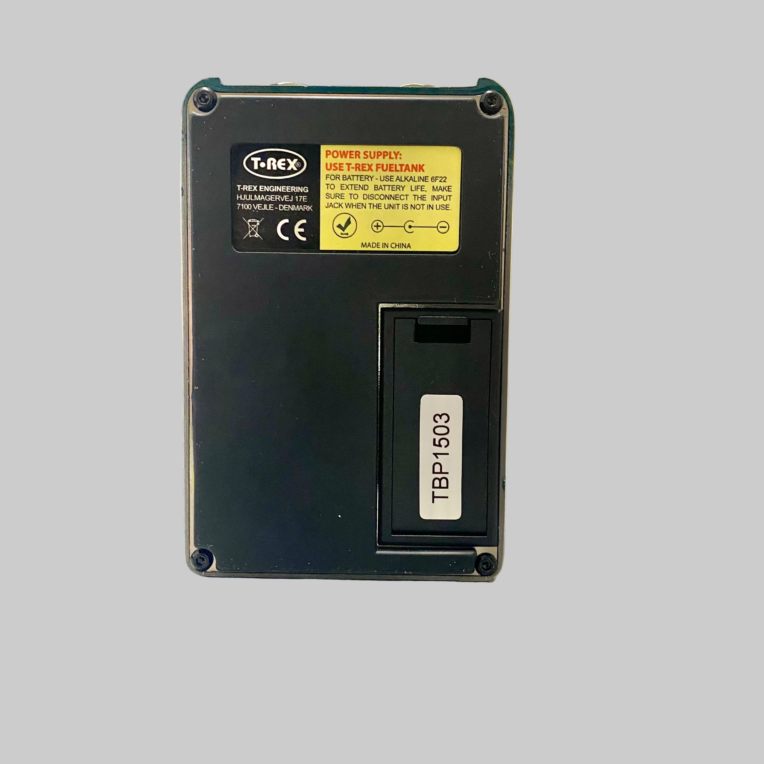 Black power supply unit with T-REX branding on a table