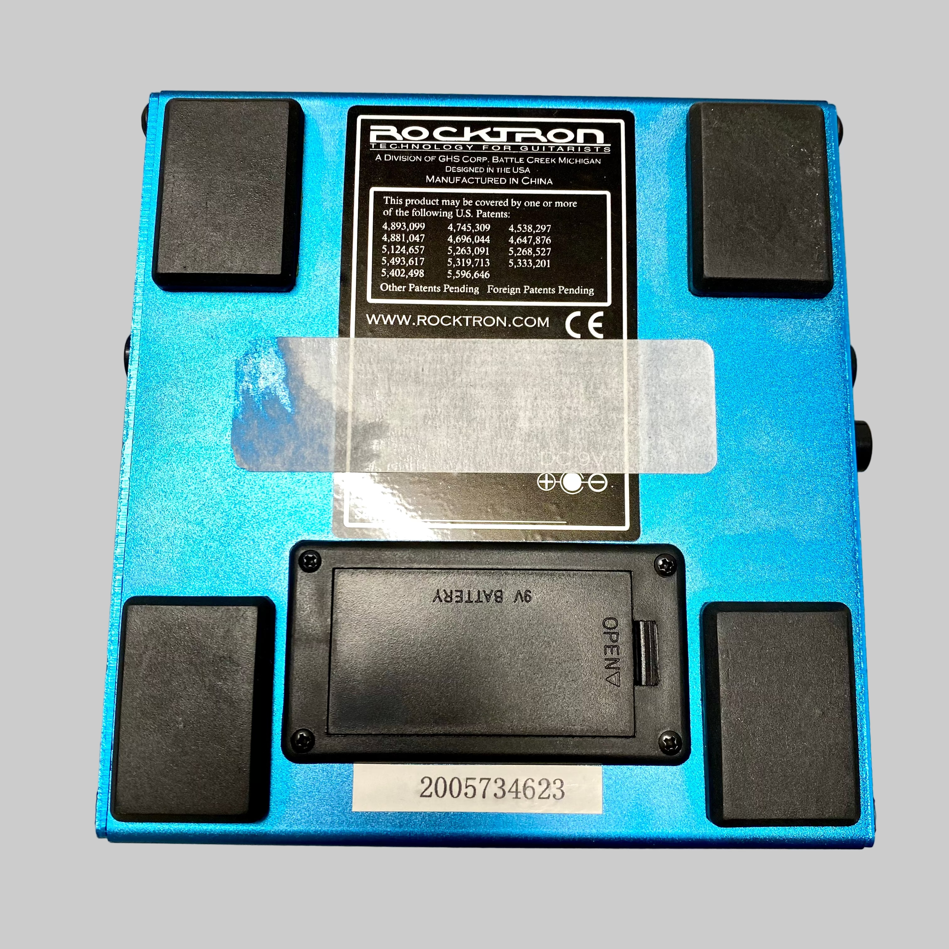 Blue electronic device with black components on a gray surface