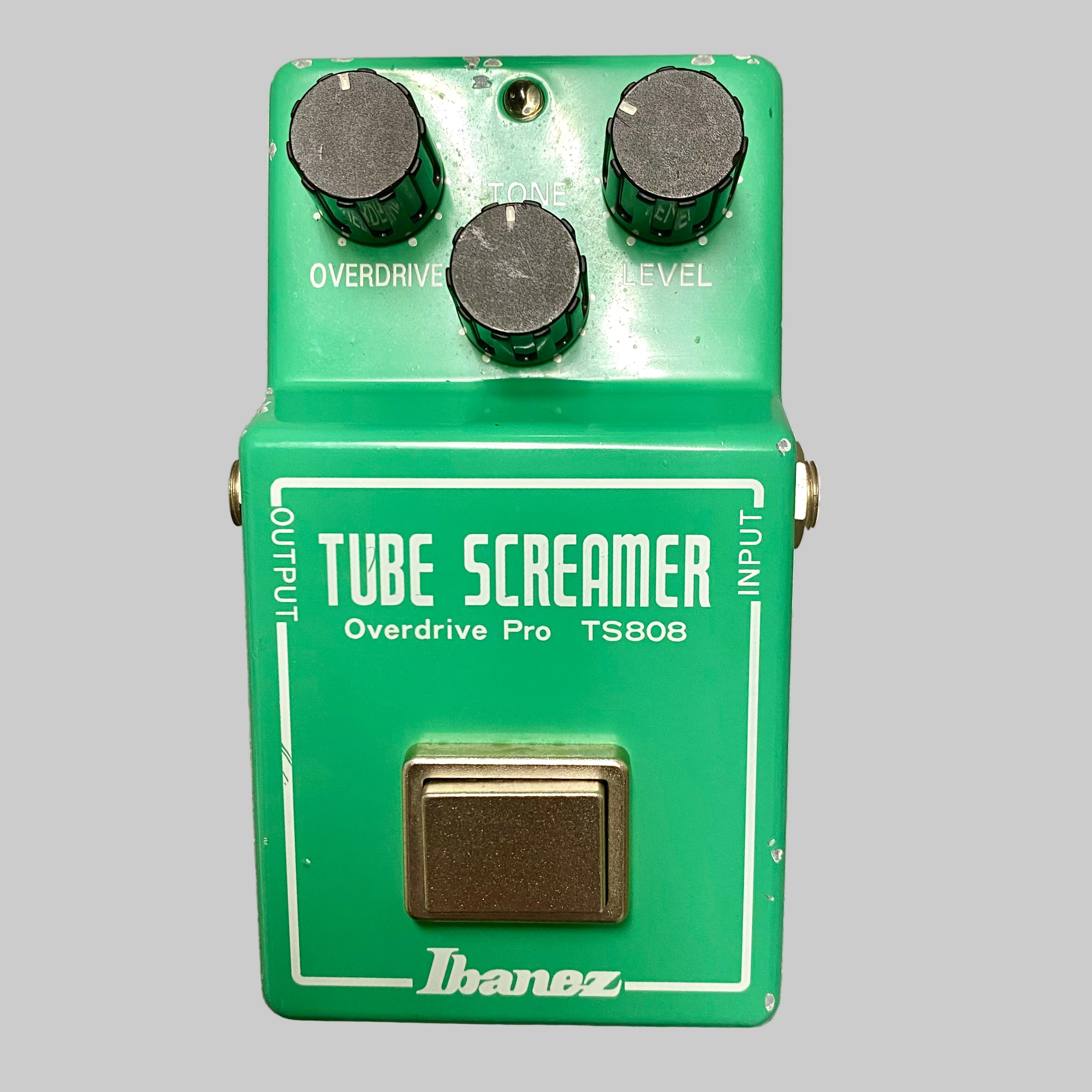 Ibanez Tube Screamer overdrive pedal on a wooden surface