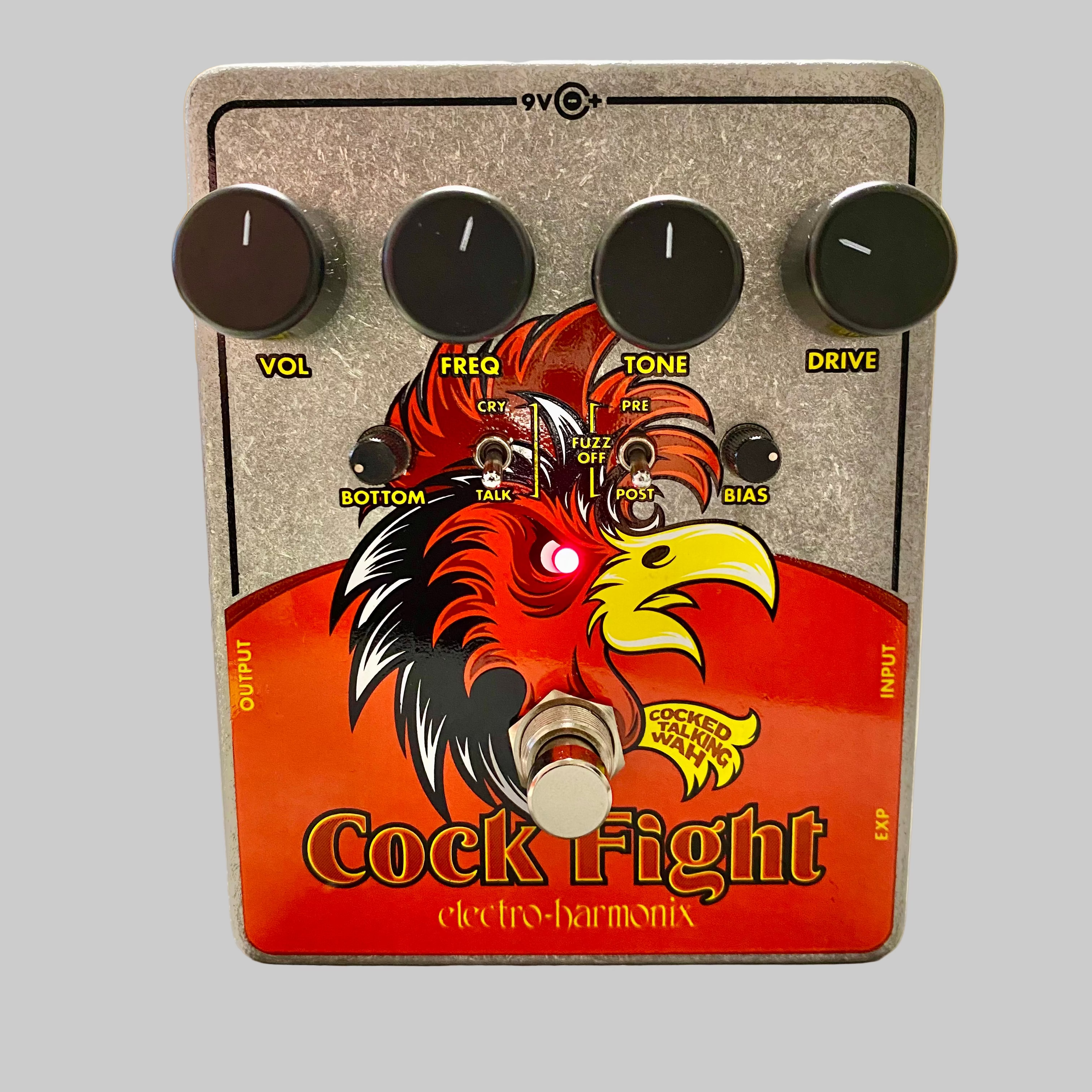 Electro-Harmonix Cock Fight guitar effects pedal on a table