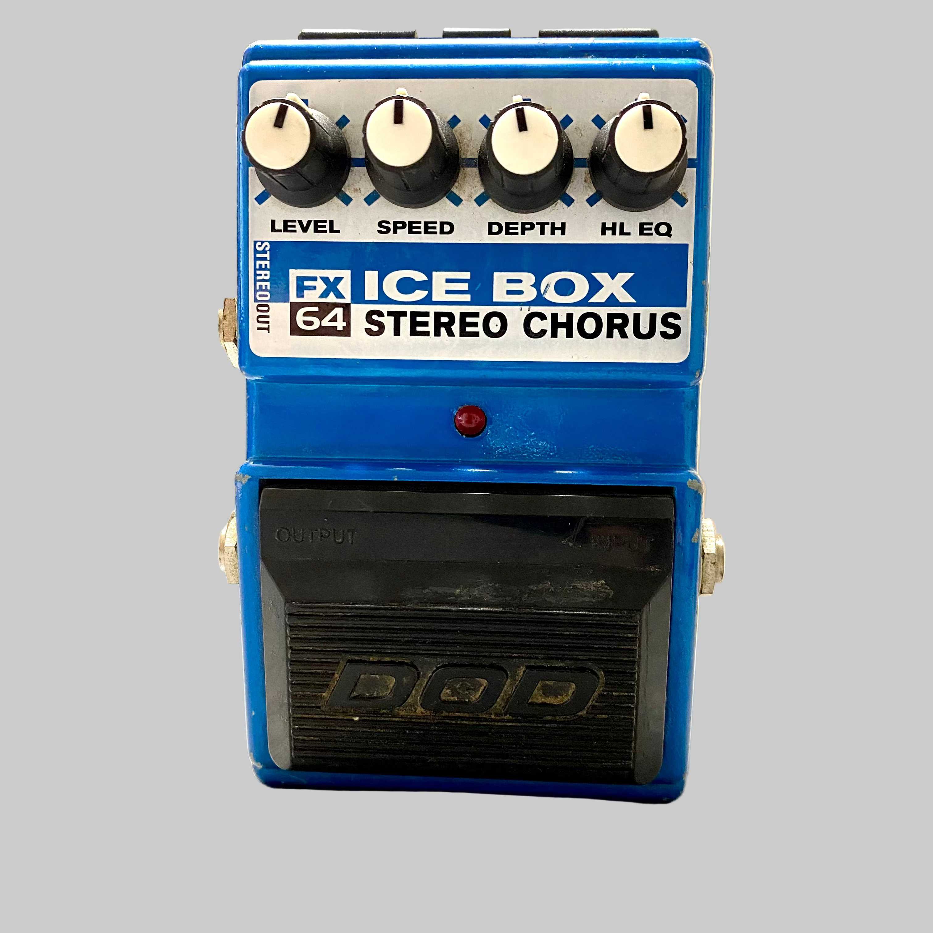Blue guitar effects pedal with 'FX Ice Box 64 Stereo Chorus' branding on a wooden surface.