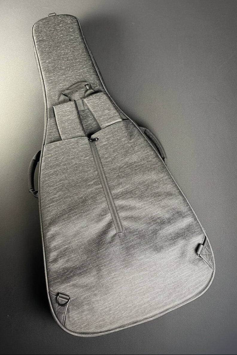 Gray guitar case on a gray surface