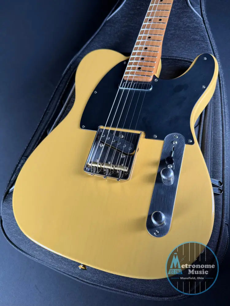 LSL T Bone electric guitar with a black pickguard on a matching case.